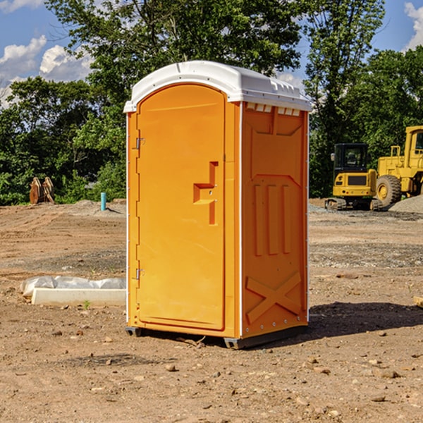 what is the cost difference between standard and deluxe portable restroom rentals in Farmersburg